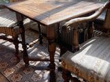an image of a dining room with a table and chairs