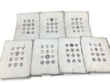 six old books with different designs on them on a white surface