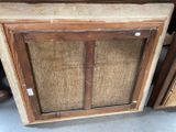 a picture of a wooden cabinet with a glass door