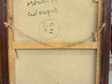 an old picture frame with writing on it sitting on a table