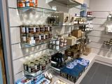 many shelves of food and condiments in this store
