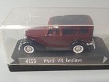 a model of a red car in a clear case