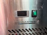 a close up of a metal object with a clock on it