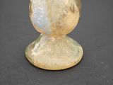 a glass vase that is sitting on a table