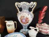 many different types of vases and bowls on the table