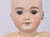 a small doll that is sitting on a table