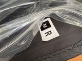 a bag of luggage wrapped in plastic and sitting on a table