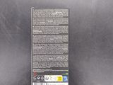 a close up of the back of a black box with a label on it