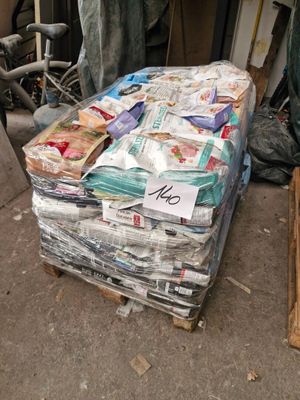 a pile of newspapers sitting on top of a pallet
