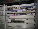 many shelves with video games on them in a store
