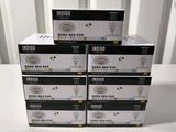 four boxes of black and white ink sitting on top of a white table