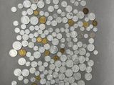 a lot of coins that are on the table