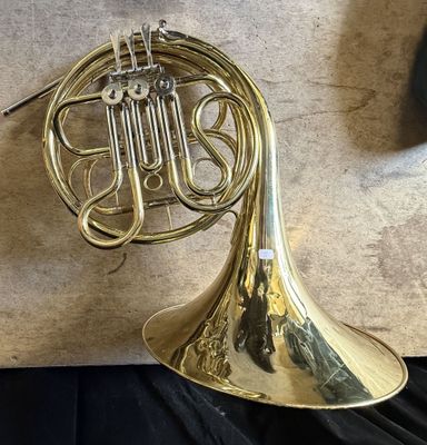 a brass instrument that is sitting on a table