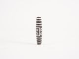 an image of a black and white vase on a white surface