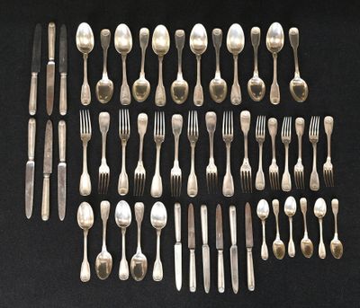 many forks and spoons laid out on the table
