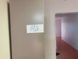 a sign that says milk on the door of a room