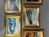 quatre tableaux accrochés au mur d'une pièce