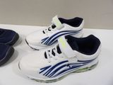 pair of white and blue shoes on a white table