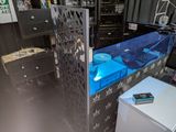 a fish tank in the middle of a room with a refrigerator