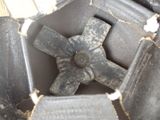 a black piece of luggage that has a metal cross on it