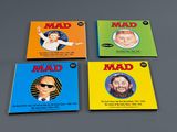 four children ' s books with a picture of a man and a woman on them