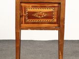 a small wooden table with a drawer on top of it
