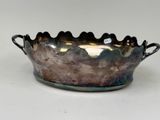 a silver bowl that is sitting on a table