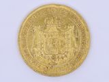 l'image d'une pièce d'or sur laquelle figurent des armoiries
