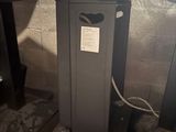 a metal box that is sitting under a table