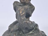 statue of a woman holding a child on her shoulders