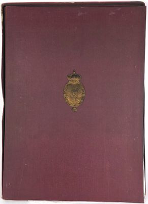 a red book with a gold emblem on the cover