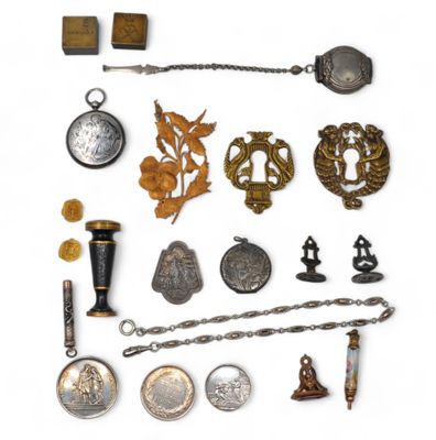 an image of a collection of antique items including a pocket watch, a chain, a pocket watch, a pocket watch, a pocket watch, and a pocket watch