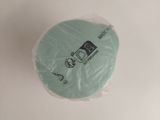 a piece of toilet paper wrapped in plastic on a white surface