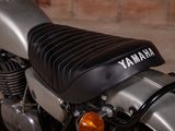 a close up of a motorcycle parked in a garage