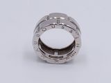 a close up of a ring on a white surface with a white background