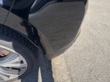 a black car parked on the side of the road