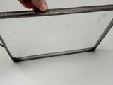 a hand that is holding a mirror on a table