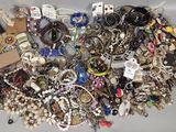 a pile of assorted jewelry sitting on a table