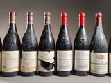 six bottles of wine are lined up in a row on a table