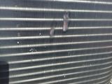 a close up of a radiator with a person standing next to it