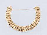 a gold chain necklace with a clasp on a white background