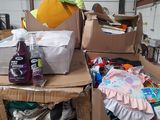 a pile of boxes with clothes on top of them