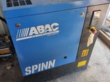 a blue machine sitting in a room next to a window