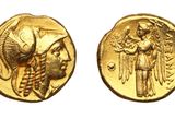 a gold coin with an image of a woman and a man on it