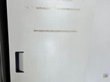a white refrigerator in the corner of a kitchen
