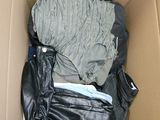 a box filled with clothes and a bag in it