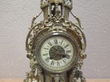 a clock that is sitting on a table in the room