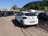 a white car parked in a parking lot next to other cars