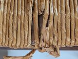 a close up of a wicker bag with a handle