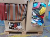 a cardboard box with a bunch of clothes inside of it